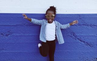 happy child standing on one foot