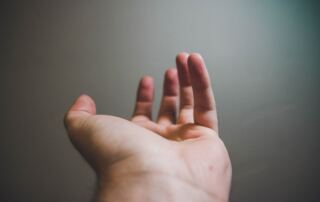 focus photography of open hand
