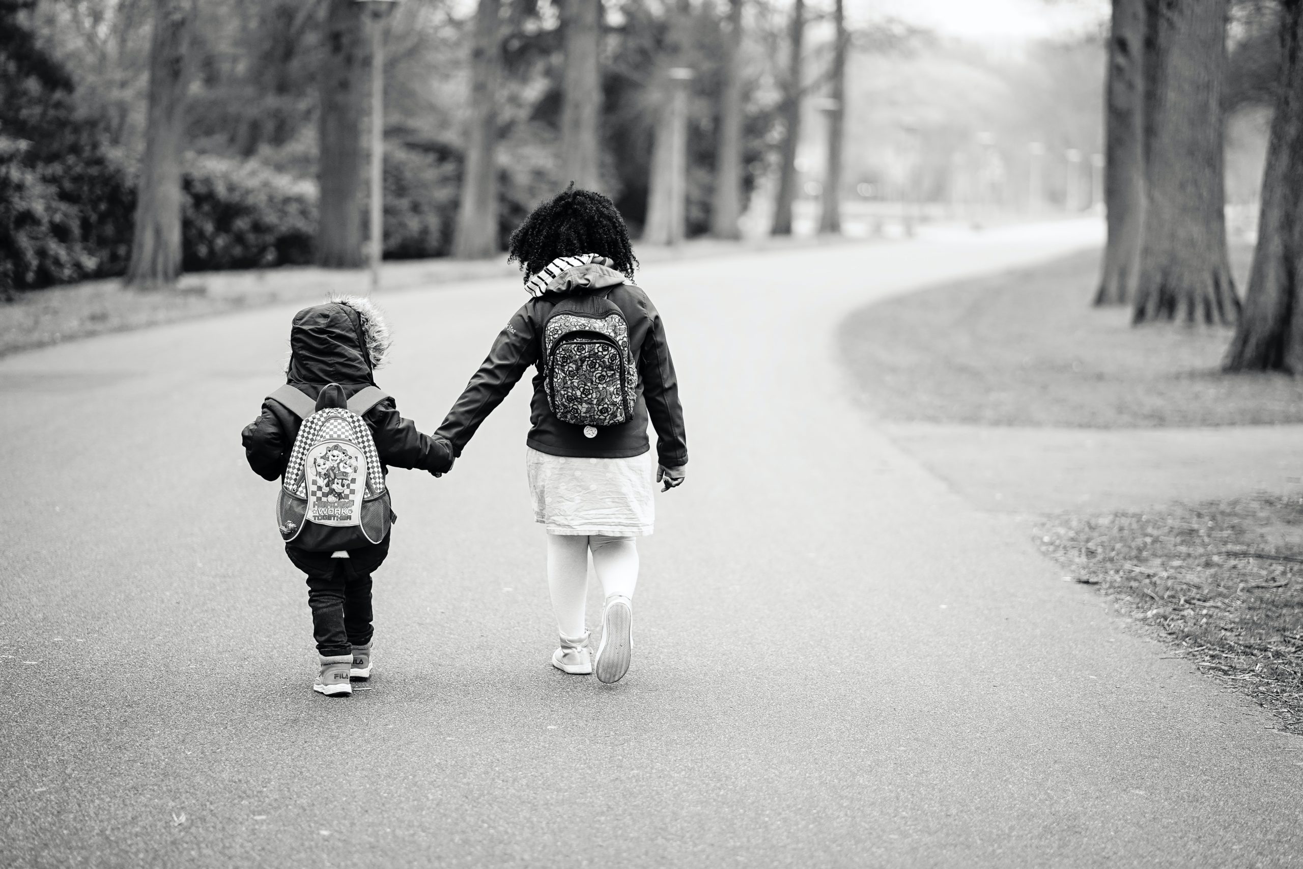 children walking hand in hand